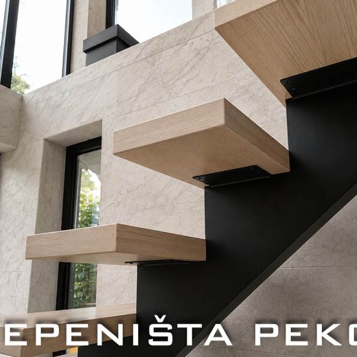 Detalj spajanja drvenih gazišta sa masivnom crnom metalnom osovinom jednoosovinskog stepeništa